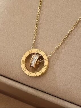 Gold Roman Numeral Circle Necklace with Sparkling Moving Ring